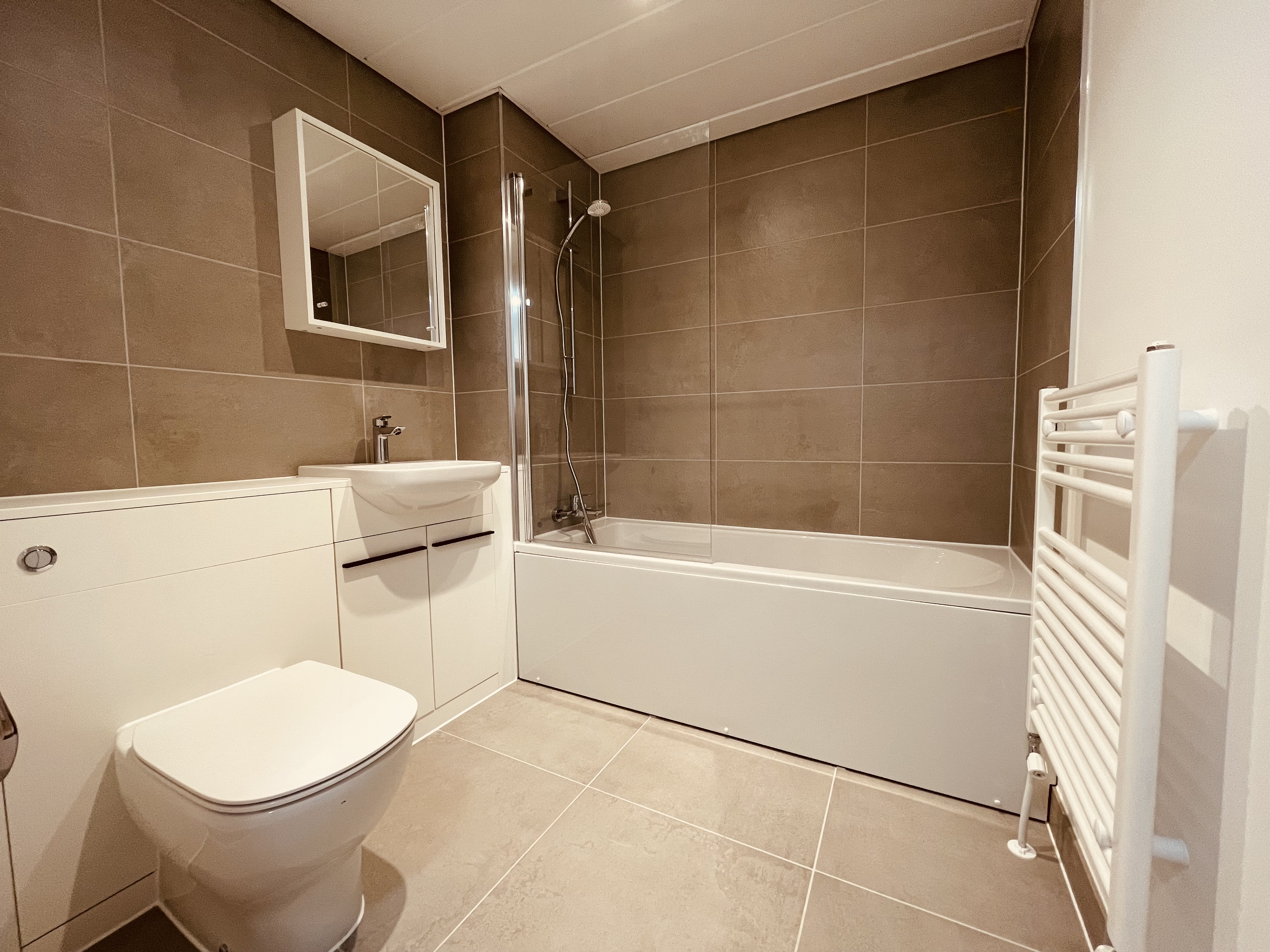 Bathroom photo of a ground floor apartment at By the Park